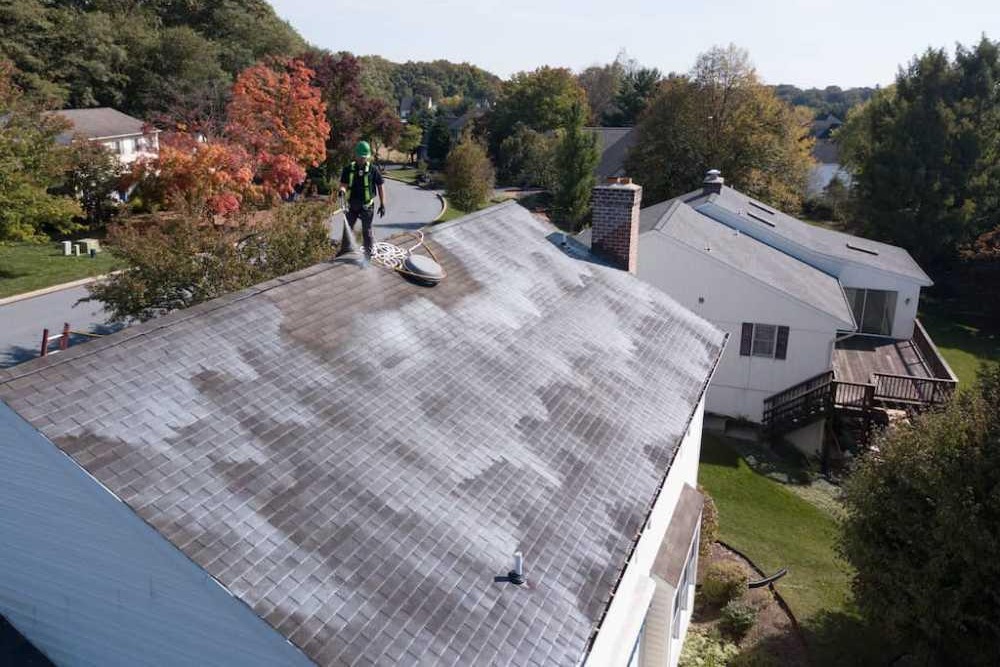 Vent pipe boot flashing sealed on an asphalt shingle roof