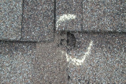 Vent pipe boot flashing sealed on an asphalt shingle roof