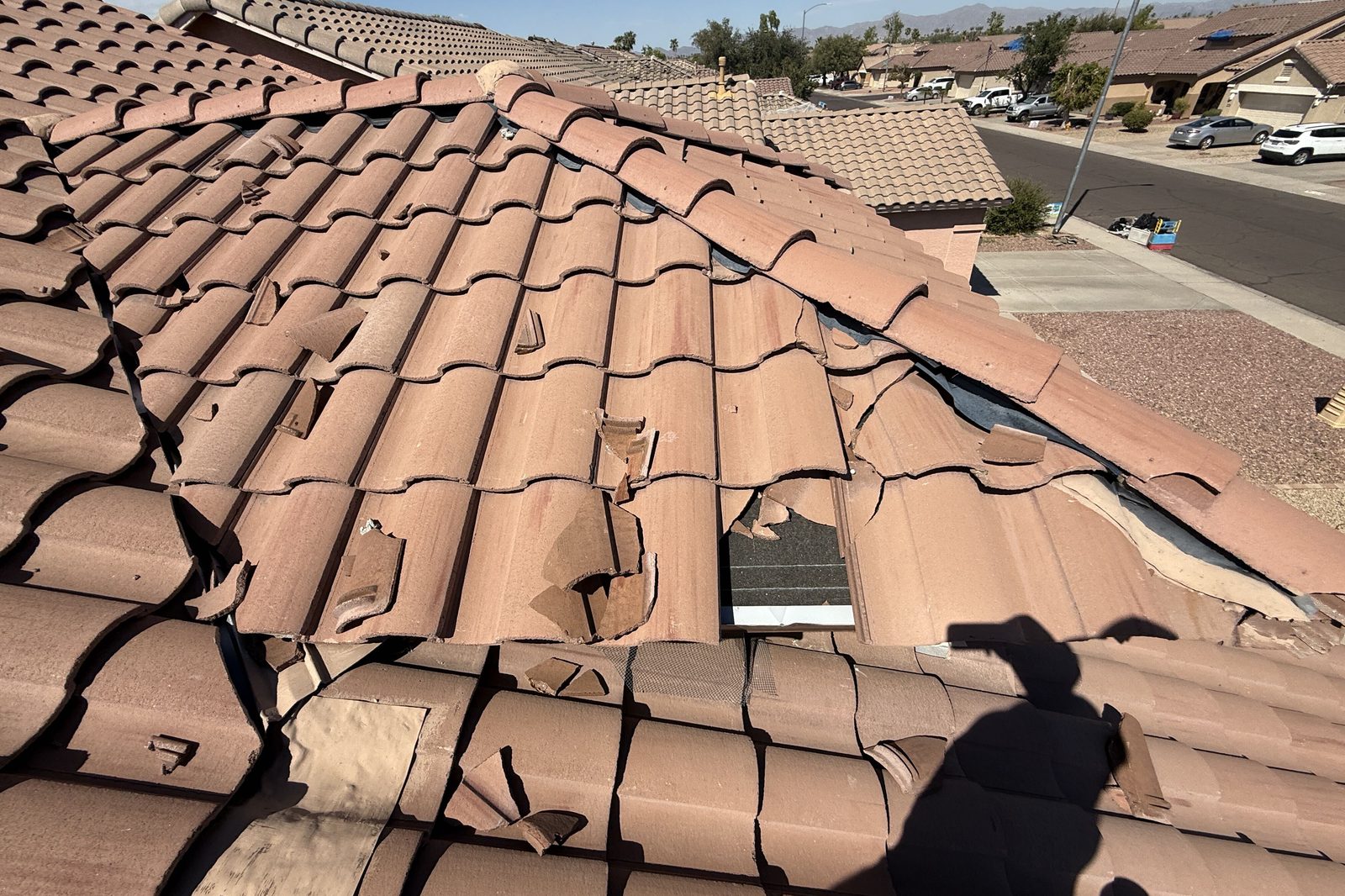 Broken roof tiles Broken roof tiles with exposed underlayment before repair