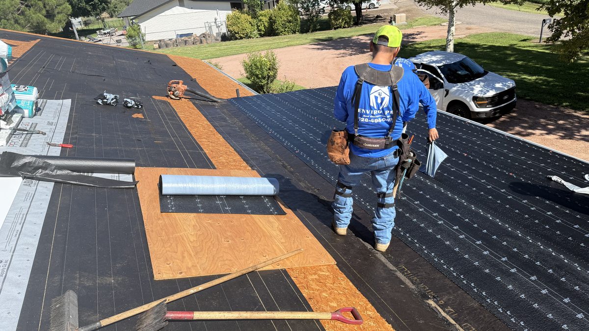 Enviro Pro crew laying underlayment on a full roof replacement