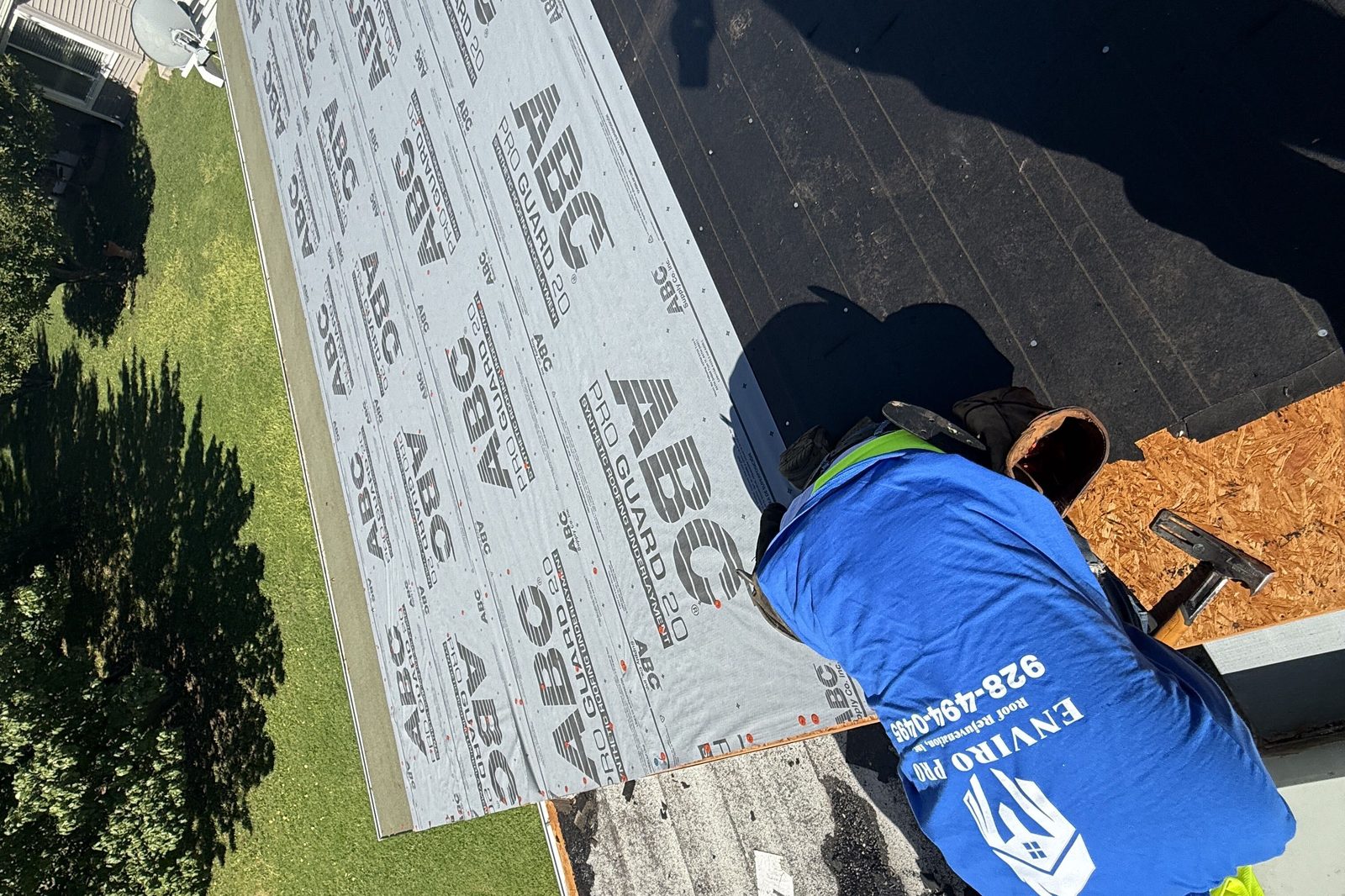 Fastening underlayment at the edge Roofer fastening synthetic underlayment at the roof edge