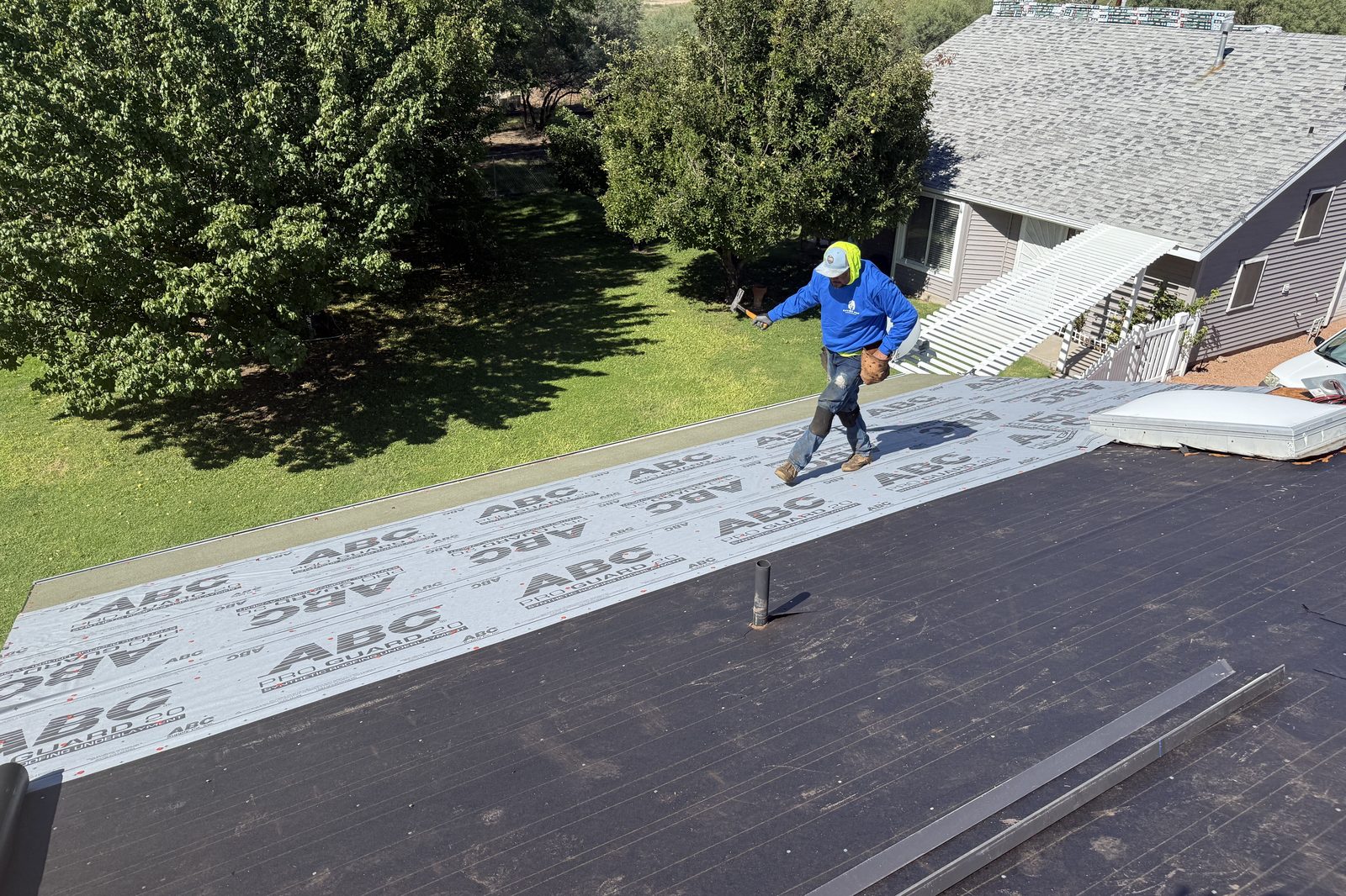 Checking the roof deck Enviro Pro roofer checking the roof deck before installing underlayment
