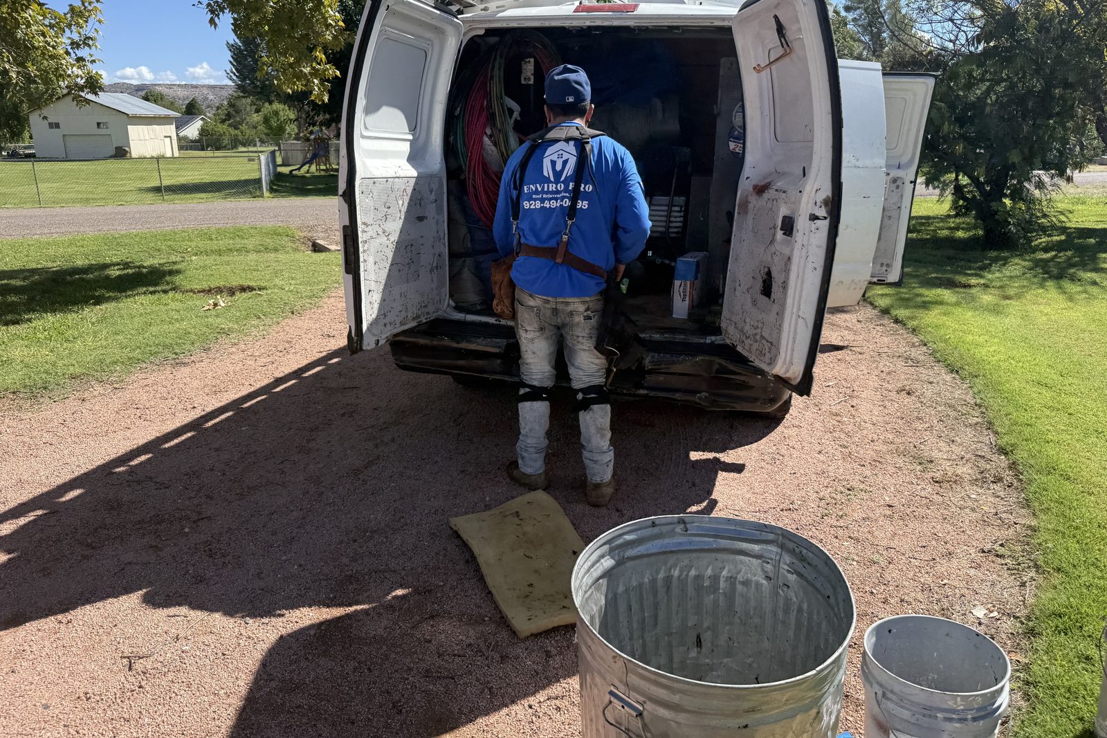 Loading the work van Enviro Pro roofer loading the work van at a job site