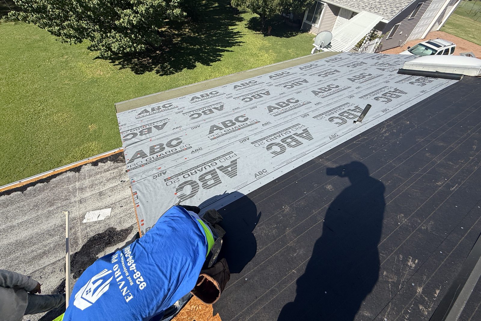 Securing underlayment Roofer securing underlayment on a freshly prepared roof deck