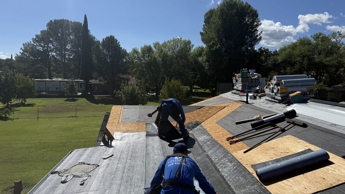 Enviro Pro roofers prepping a roof deck for new underlayment and shingles