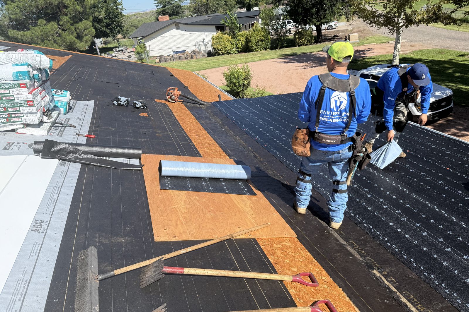 Roofing crew at work Enviro Pro roofing crew at work on a residential roof replacement