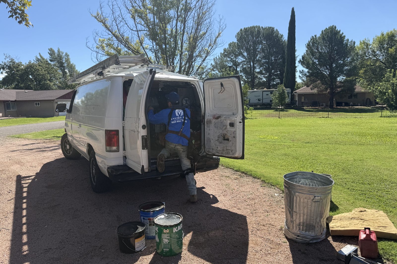 Enviro Pro van at job site Enviro Pro work van parked at a roof replacement job site