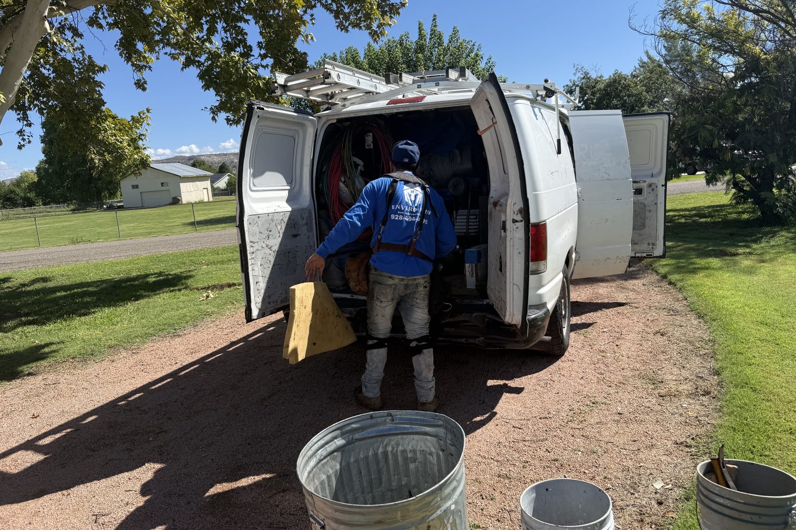 Enviro Pro van and crew on site Enviro Pro work van and crew on site at a residential roof replacement